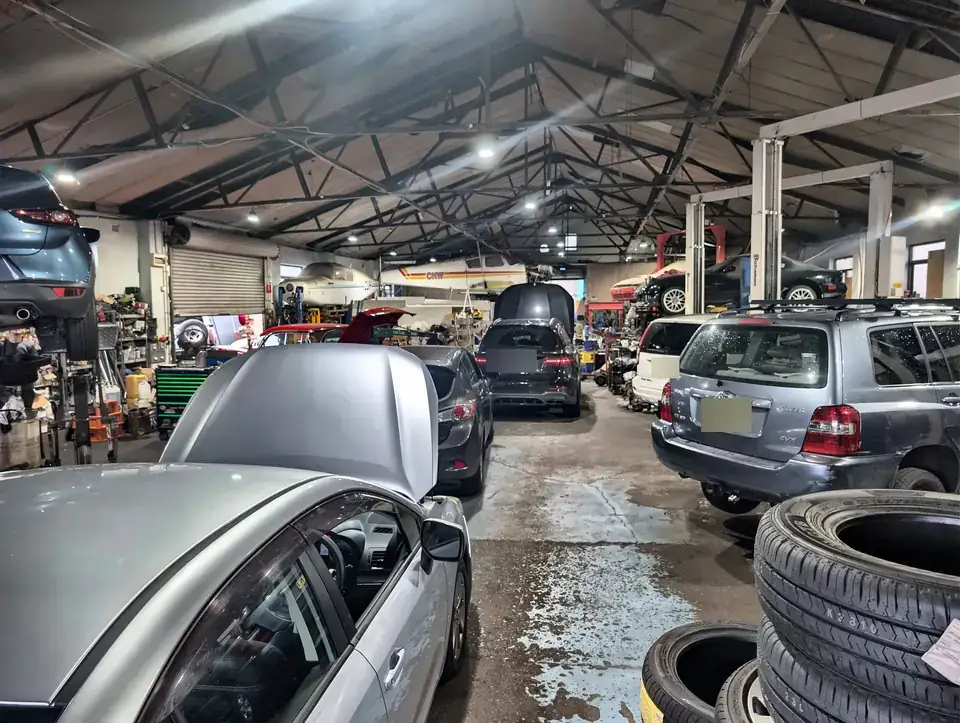 Cars in for service inside the Andrew's Mechanical workshop in Kings Park