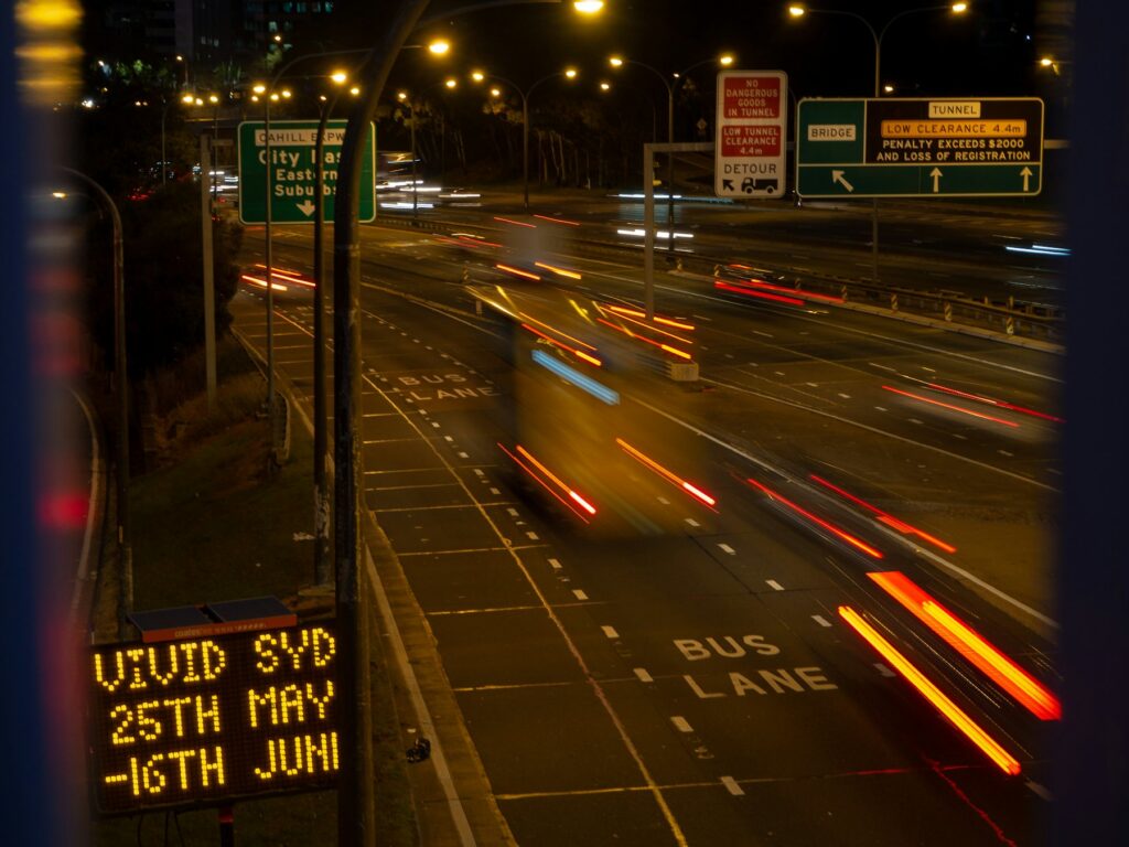 Night traffic with light trails on a busy road