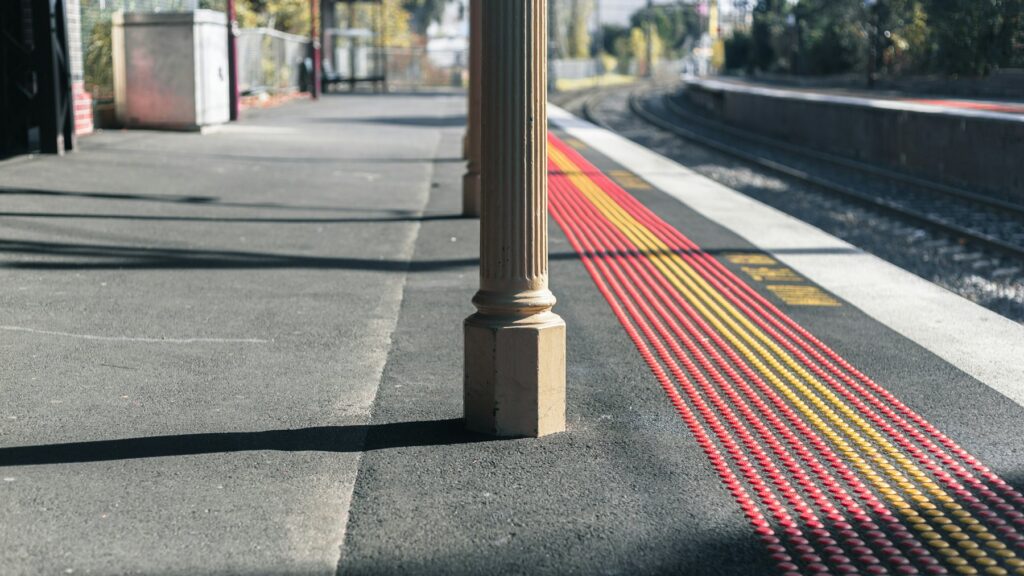 Railway station platform with a yellow tactile strip